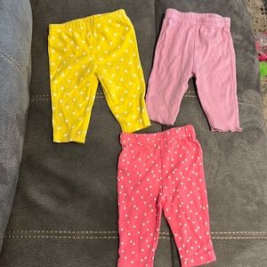 Baby girl pants size 0-3 months pink and yellow hearts and solid purple.